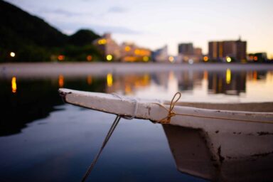 A boat tied to a dock, gently floating on the calm water, depicting the symptoms of early-onset Alzheimer's